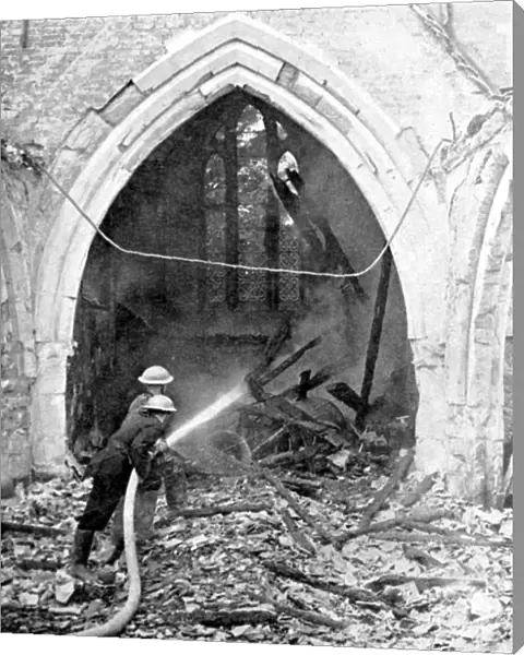British firefighters damping down a bombed church, World War II, June 1940
