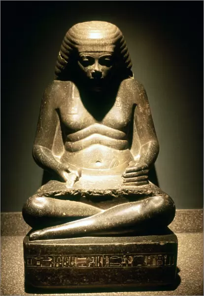 Granite statue of a seated Ancient Egyptian scribe, from Karnak, 17  /  18th dynasty, c1500 BC