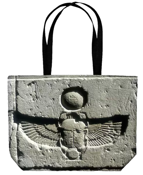 Limestone relief of a scarab beetle and vulture wings under a disk of the sun, Edfu, Egypt