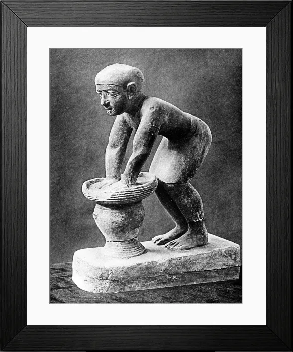 Framed Print : Figure of an Ancient Egyptian brewer pressing out fermented bread in a basket, c1910 Framed Print : Figure of an Ancient Egyptian brewer pressing out fermented bread in a basket, c1910