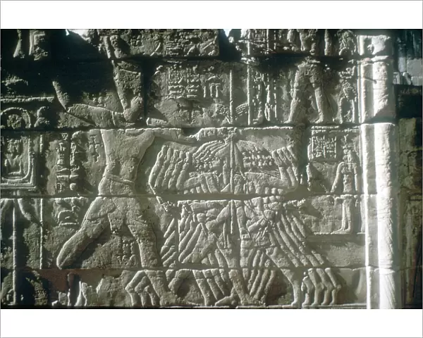 Rameses III smiting his enemies before Amun-Ra, Mortuary Temple, Medinat Habu, Egypt, c12th cen BC