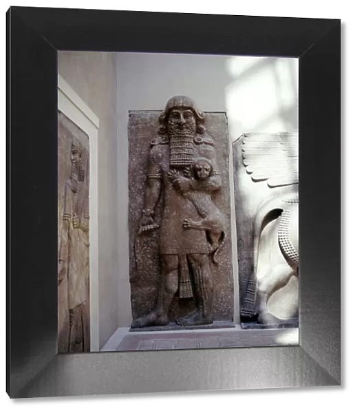 Assyrian sculpture of Gilgamesh holding a lion, Khorsabad, c8th century BC
