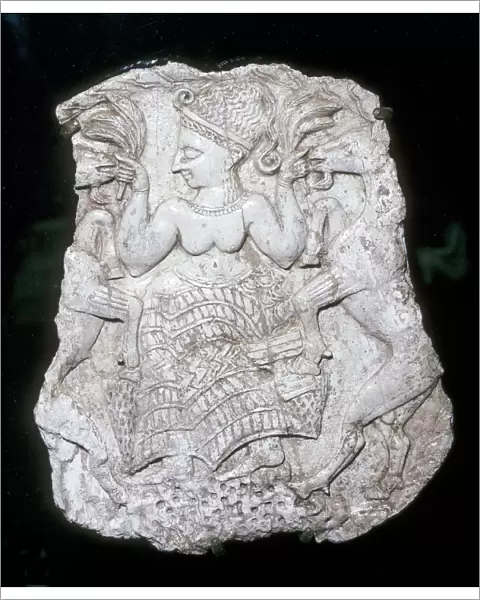 Ivory cosmetic box cover depicting a goddess feeding caprids, Tomb at Minet-el-Beida, c1250 BC
