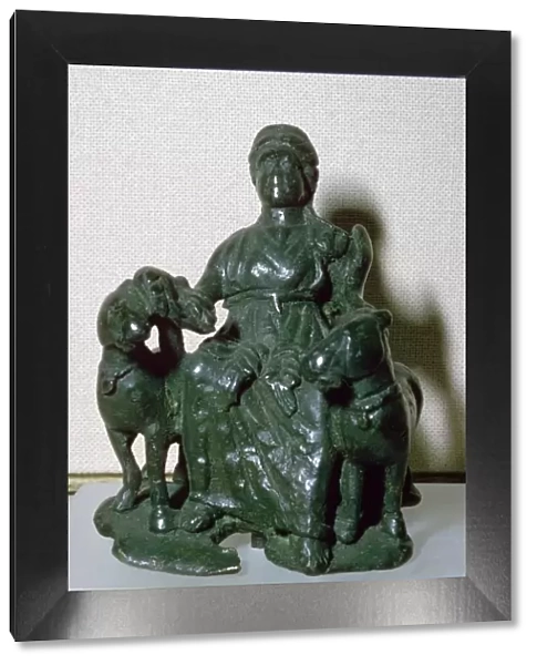 Copper alloy figure of the goddess Epona, seated between two ponies, from Wiltshire, England
