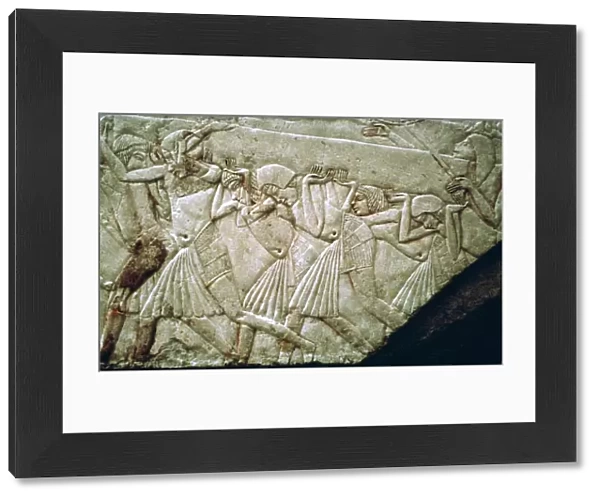 Egyptian relief of men moving a stone lintel