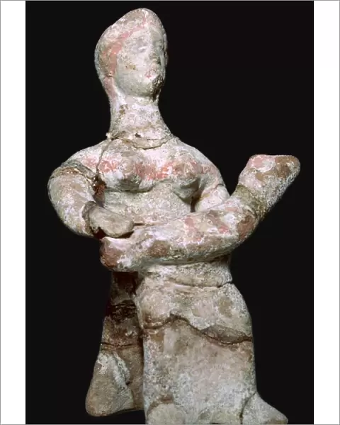 Greek terracotta statuette of a woman with a baby