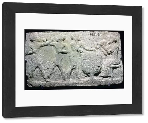 Baked clay plaque of two boxers fighting, while musicians play, from Larsa, Iraq, 2000BC-1750BC
