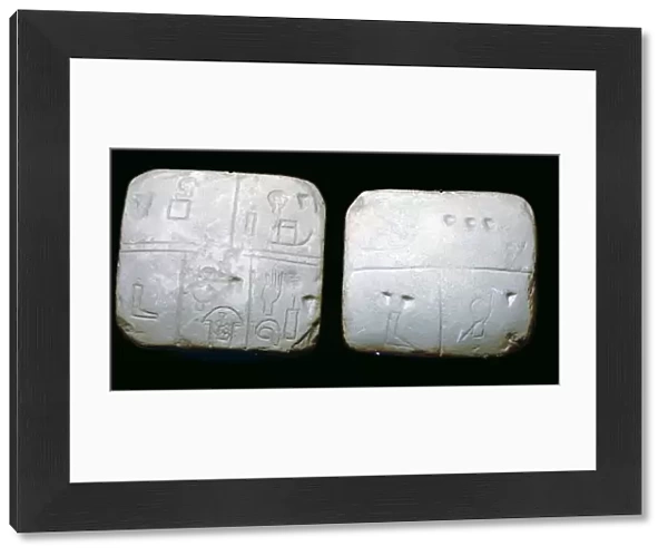 Early Sumerian stone tables, inscribed with very early archaic pictographic symbols