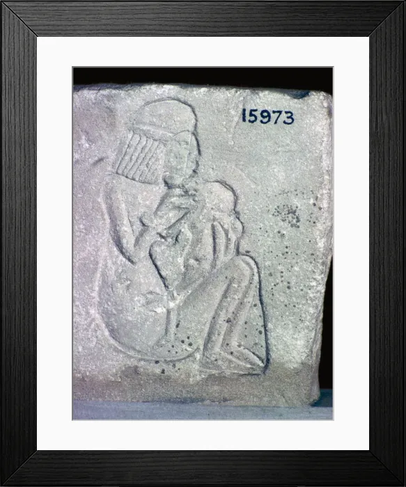 Framed Print : Egyptian relief of a woman suckling a child, 14th century BC Framed Print : Egyptian relief of a woman suckling a child, 14th century BC
