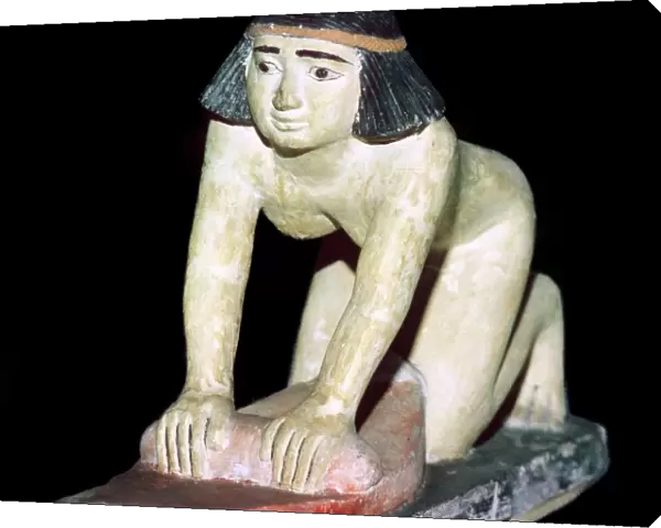 Painted figure of an Egyptian servant making bread