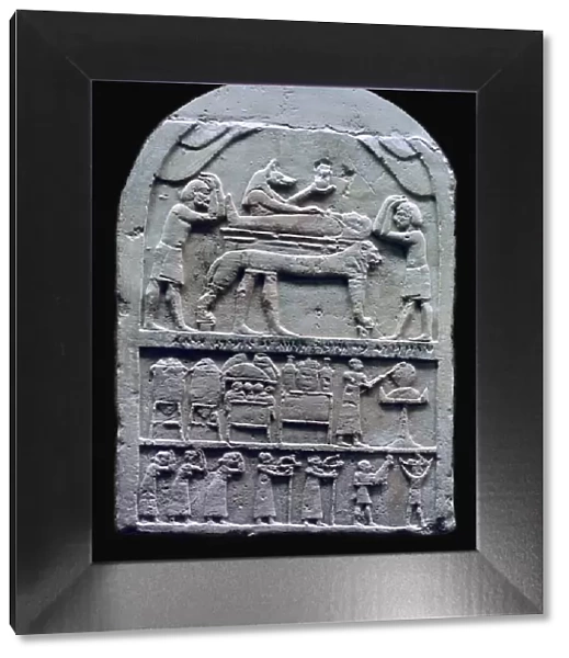 Egyptian stele showing Anubis preparing a mummy