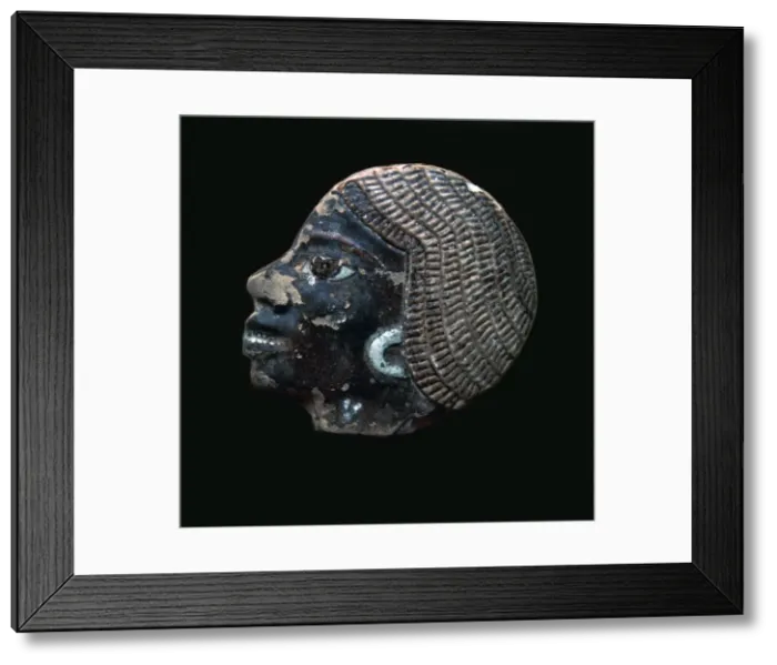Framed Print : Egyptian glazed relief of a black slave Framed Print : Egyptian glazed relief of a black slave