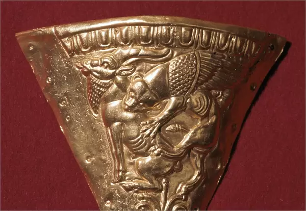 Scythian gold plate showing a winged panther attacking a goat