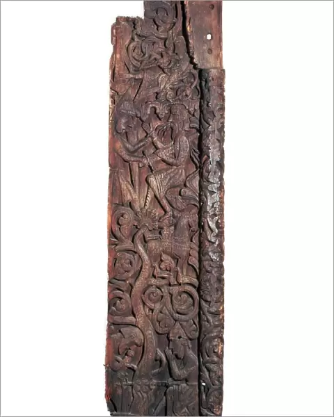 Wooden portal of Hylestad church, showing Sigurd roasting the dragons heart