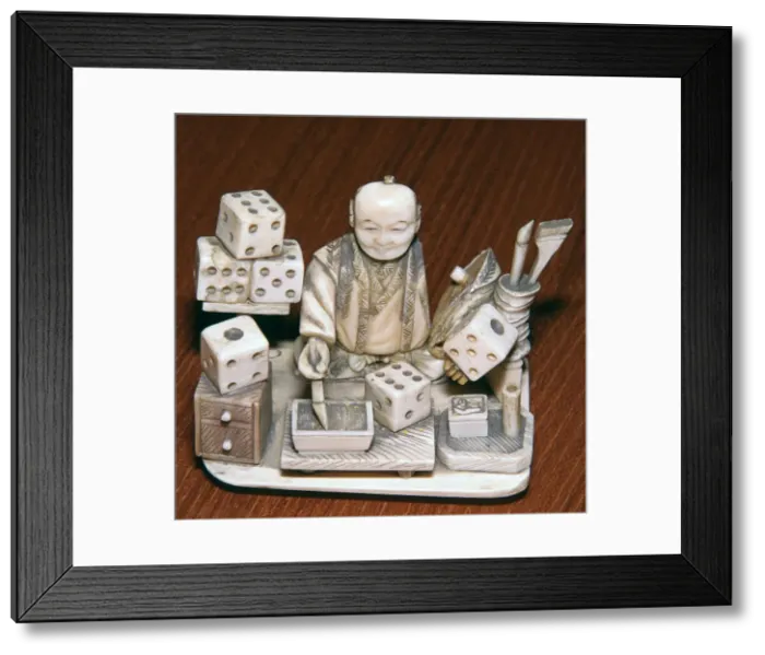 Framed Print : Japanese ivory of a dice painter, 19th century Framed Print : Japanese ivory of a dice painter, 19th century