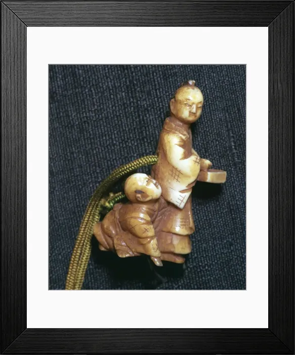 Framed Print : Japanese Netsuke of a man and boy at new year, 19th century Framed Print : Japanese Netsuke of a man and boy at new year, 19th century