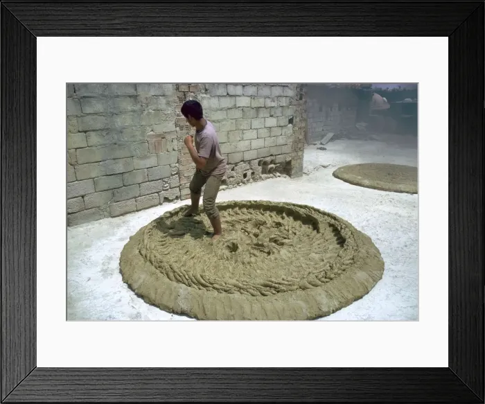 Framed Print : Treading clay for pottery in Tunisia. Artist: CM Dixon Framed Print : Treading clay for pottery in Tunisia. Artist: CM Dixon
