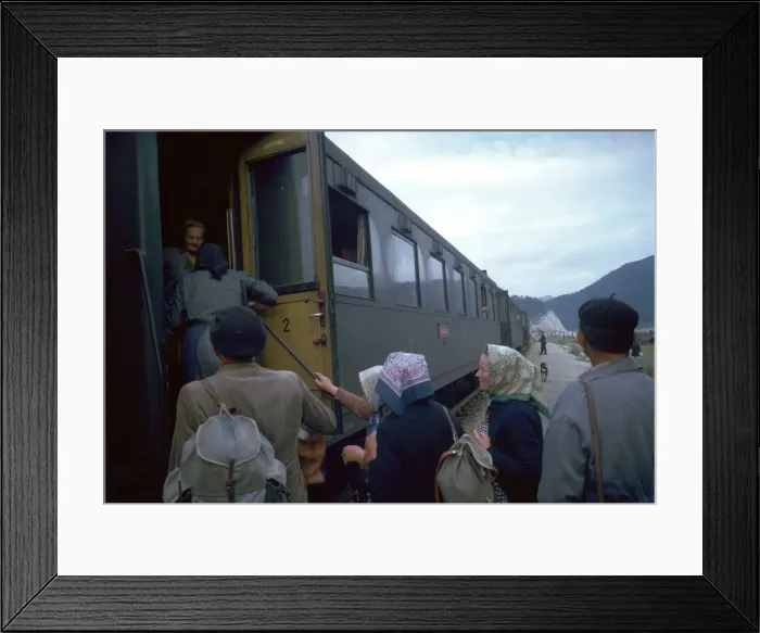 Framed Print : Local people boarding a train in Czechslovakia. Artist: CM Dixon Framed Print : Local people boarding a train in Czechslovakia. Artist: CM Dixon