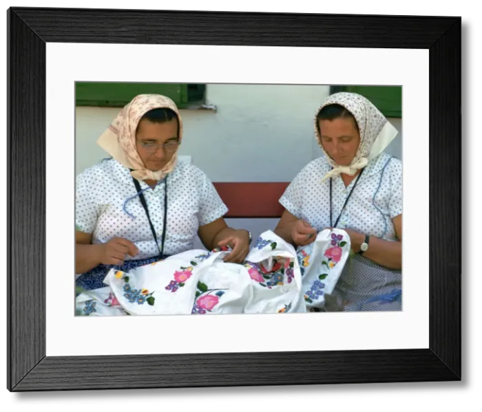 Framed Print : Two Hungarian women embroidering. Artist: CM Dixon Framed Print : Two Hungarian women embroidering. Artist: CM Dixon