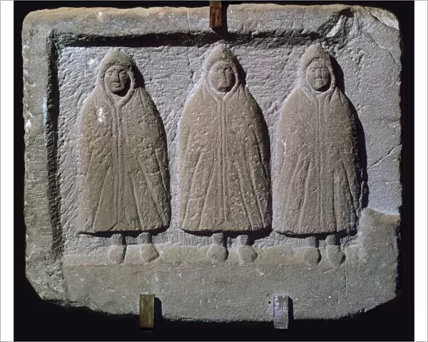 Stone relief of a trio of hooded Romano-British deities, 3rd century