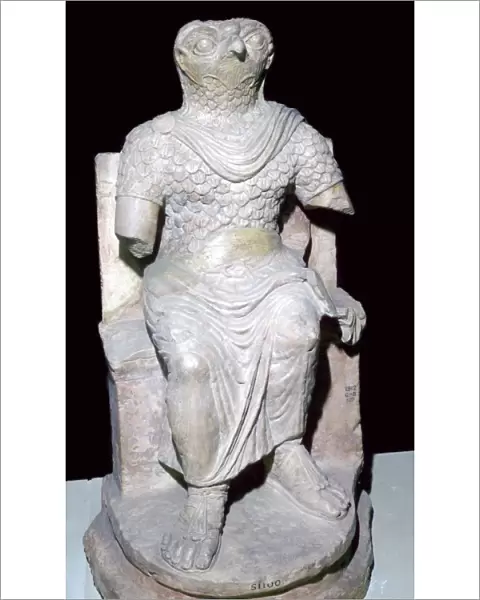 Limestone seated figure of Horus wearing Roman military costume, Egyptian