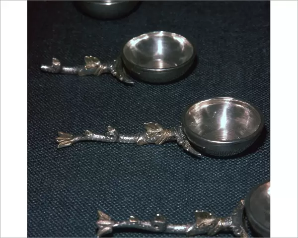 Roman silver and gilt ladles with handles cast in the form of dolphins, 4th century