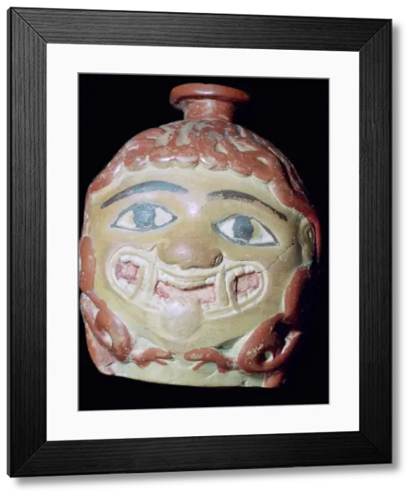 Framed Print : Terracotta Gorgons head bottle