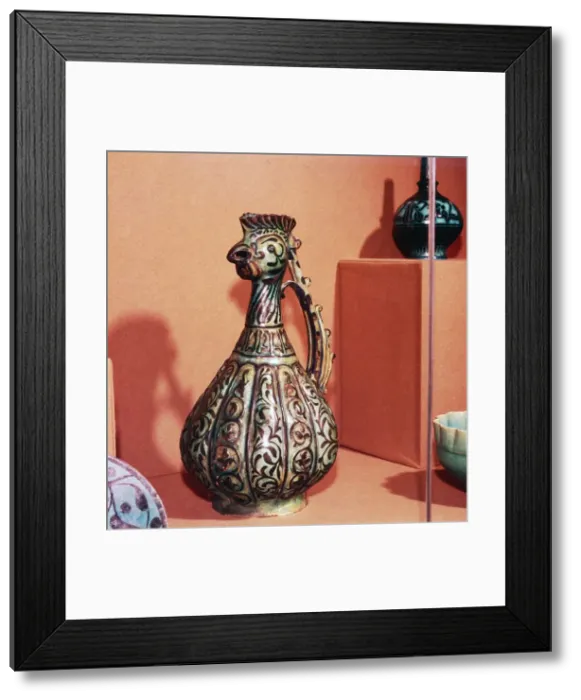 Framed Print : Persian (Kashan) Ewer with cockerels head and tail handle, early 13th century Framed Print : Persian (Kashan) Ewer with cockerels head and tail handle, early 13th century