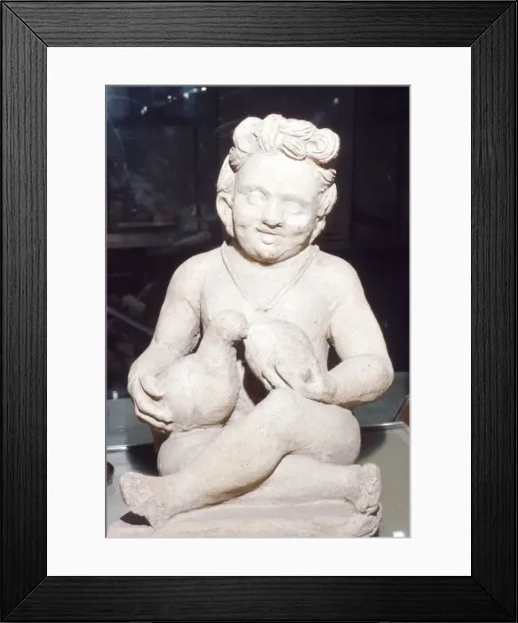 Framed Print : Terracotta Etruscan Votive of Child Feeding Bird, from Vulci, c2nd century BC Framed Print : Terracotta Etruscan Votive of Child Feeding Bird, from Vulci, c2nd century BC