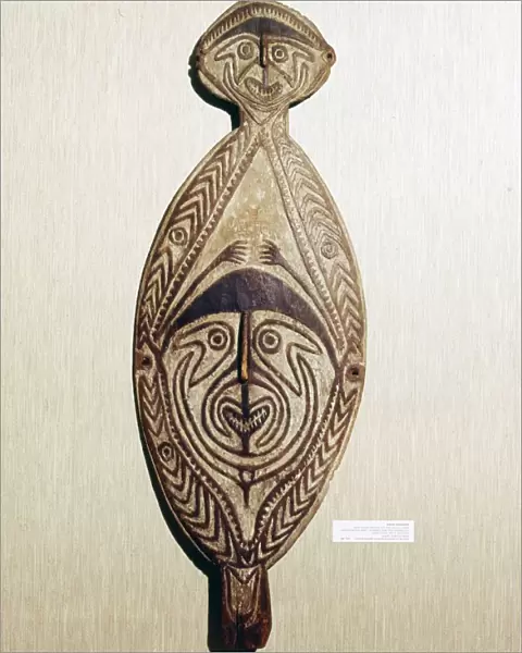 Ancestral Board, wood carved with two human faces