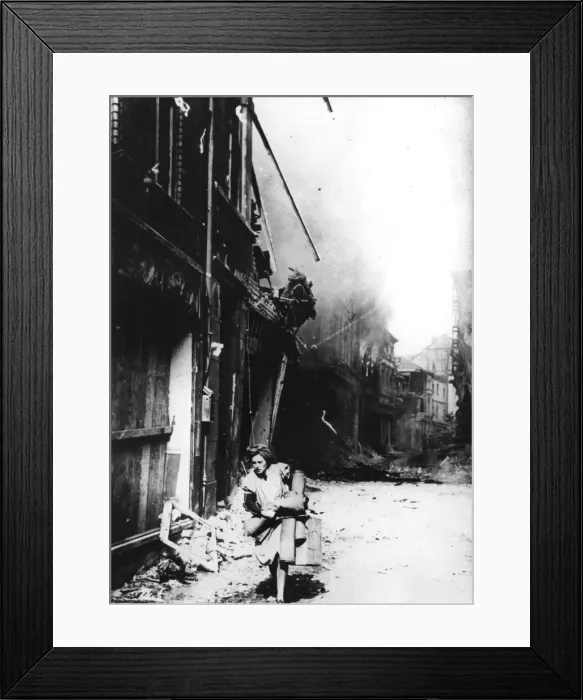 Framed Print : A woman leaving her burning house in a bombed street, Germany, 1945 Framed Print : A woman leaving her burning house in a bombed street, Germany, 1945