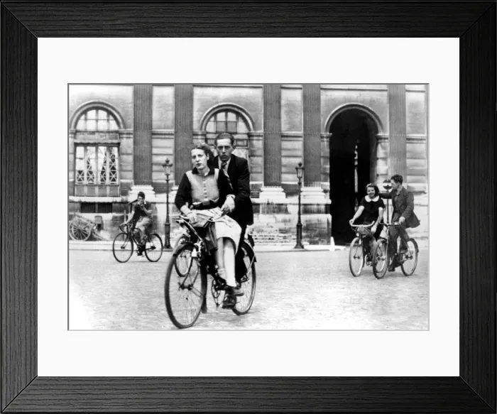 Framed Print : Parisians travelling by bicycle, German-occupied Paris, July 1940 Framed Print : Parisians travelling by bicycle, German-occupied Paris, July 1940