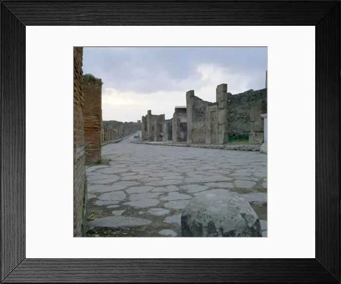 Framed Print : A cobblestone Roman road in Pompeii, Italy Framed Print : A cobblestone Roman road in Pompeii, Italy