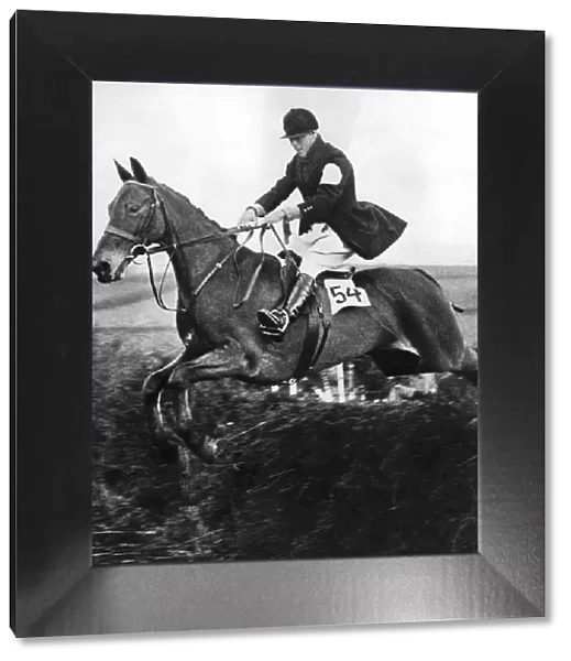 The Prince of Wales taking a fence in the bridge of Guards Challenge Cup race, c1930s
