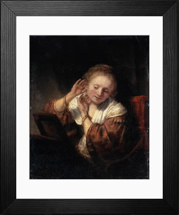 Framed Print : Young Woman trying on Earrings, 1657. Artist: Rembrandt Harmensz van Rijn Framed Print : Young Woman trying on Earrings, 1657. Artist: Rembrandt Harmensz van Rijn