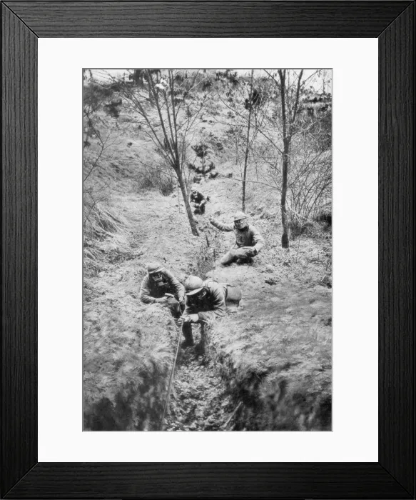 Framed Print : Fench sappers in gas masks re-laying telephone lines after a bombardment, 1918 Framed Print : Fench sappers in gas masks re-laying telephone lines after a bombardment, 1918