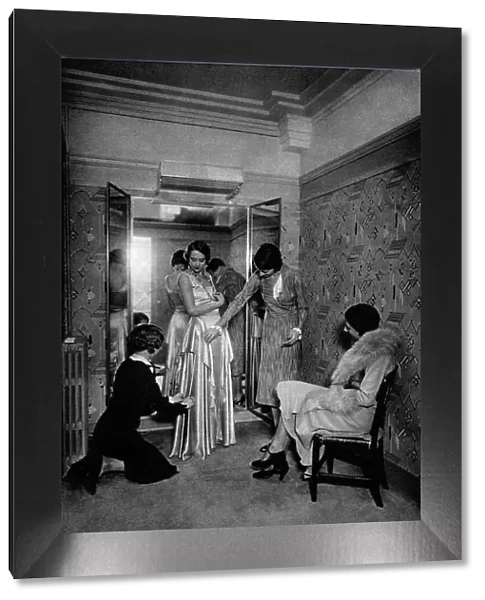 Trying on a dress at a great dressmakers, Paris, 1931. Artist: Ernest Flammarion