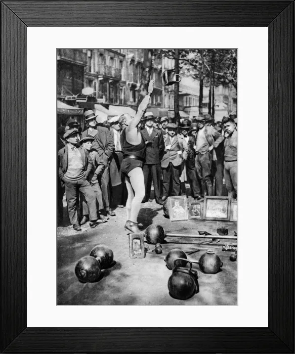 Framed Print : Strongman juggling with weights, Paris, 1931. Artist: Ernest Flammarion Framed Print : Strongman juggling with weights, Paris, 1931. Artist: Ernest Flammarion