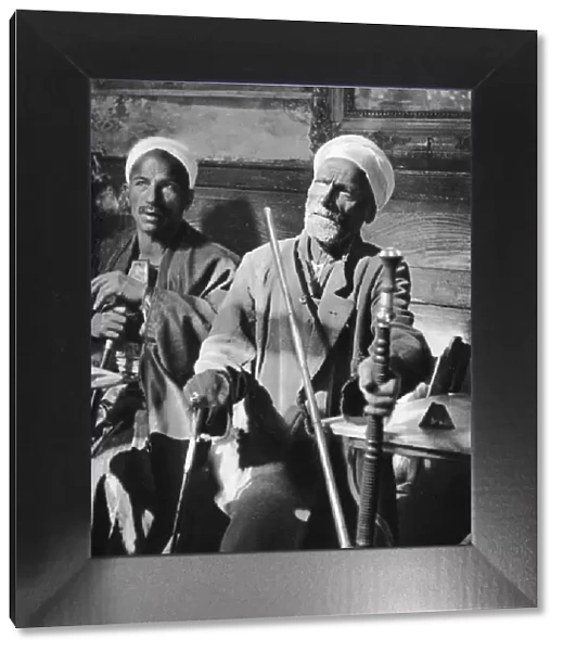 Smoking the narghileh, Cairo, 1937. Artist: Martin Hurlimann