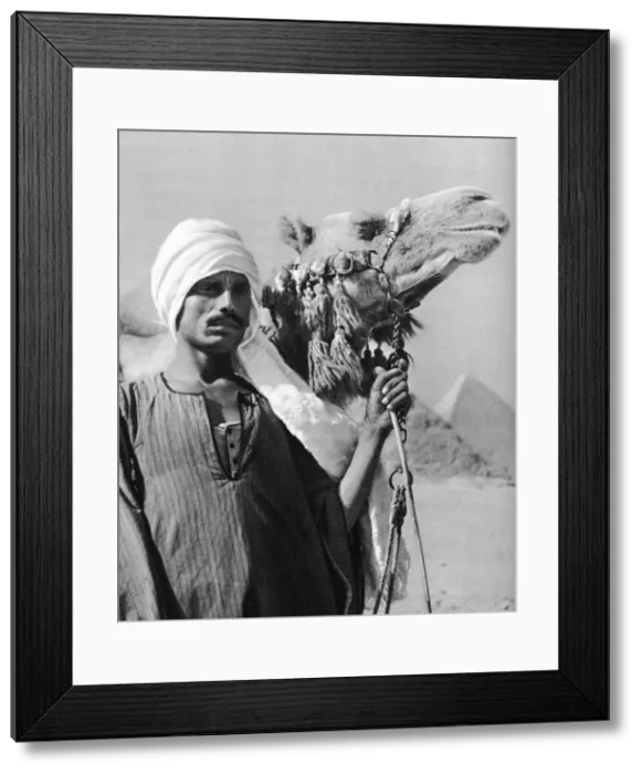Framed Print : Cameldriver near the pyramids, Egypt, 1937. Artist: Martin Hurlimann Framed Print : Cameldriver near the pyramids, Egypt, 1937. Artist: Martin Hurlimann