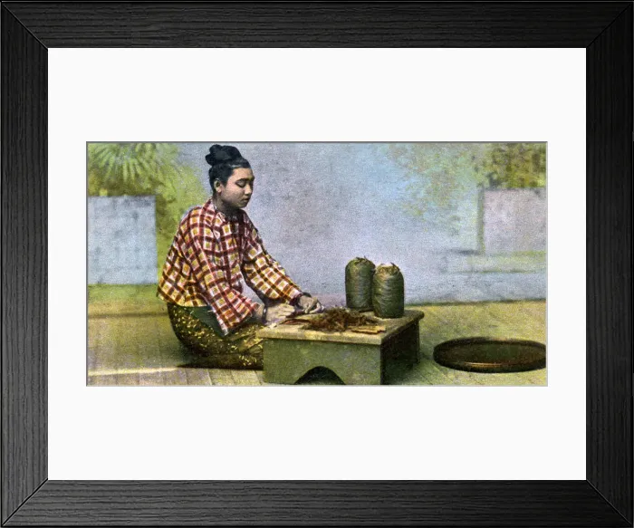 Framed Print : A Burmese woman making cigars, c1900s