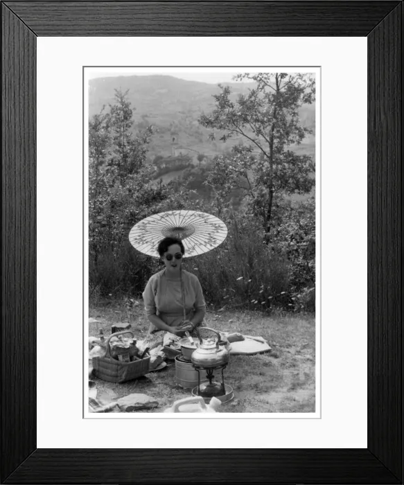 Framed Print : Woman under a parasol having a picnic, c1950-1969(?) Framed Print : Woman under a parasol having a picnic, c1950-1969(?)