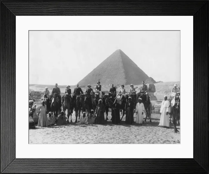 Framed Print : Camel tour in front of one of the Pyramids of Giza, Egypt, c1920s-c1930s(?) Framed Print : Camel tour in front of one of the Pyramids of Giza, Egypt, c1920s-c1930s(?)