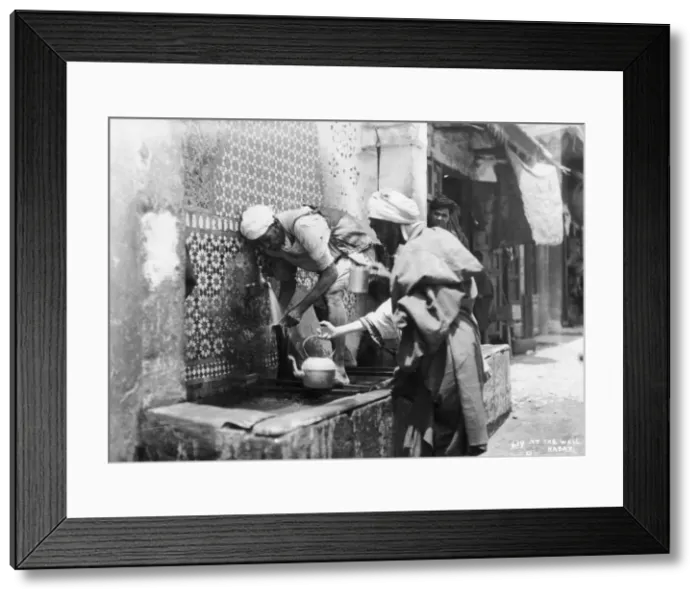 Framed Print : People collecting water from a well, Rabat, Morocco, c1920s-c1930s(?) Framed Print : People collecting water from a well, Rabat, Morocco, c1920s-c1930s(?)