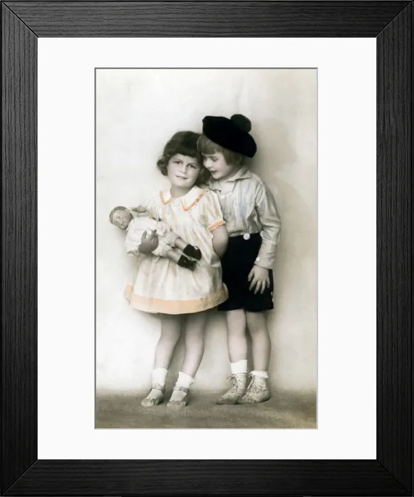 Framed Print : A young girl and boy, early 20th century Framed Print : A young girl and boy, early 20th century