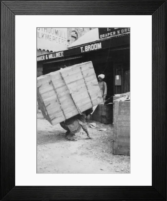 Framed Print : A porter lifting a large load, Chakrata, India, 1917 Framed Print : A porter lifting a large load, Chakrata, India, 1917