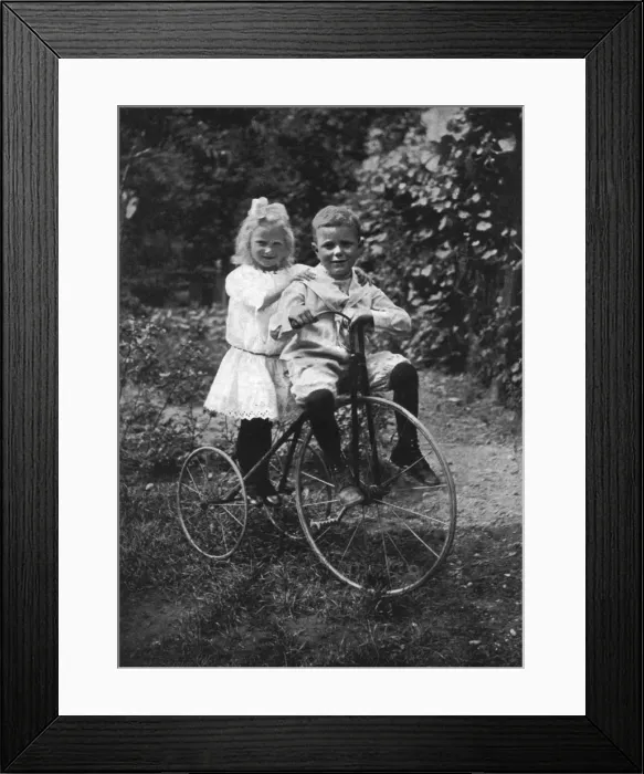 Framed Print : Two children on a tricycle, 1911-1912. Artist: CW Perry Framed Print : Two children on a tricycle, 1911-1912. Artist: CW Perry