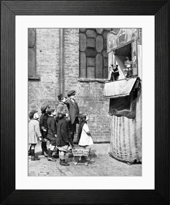 Framed Print : Children watching a Punch and Judy show in a London street, 1936. Artist: Donald McLeish Framed Print : Children watching a Punch and Judy show in a London street, 1936. Artist: Donald McLeish