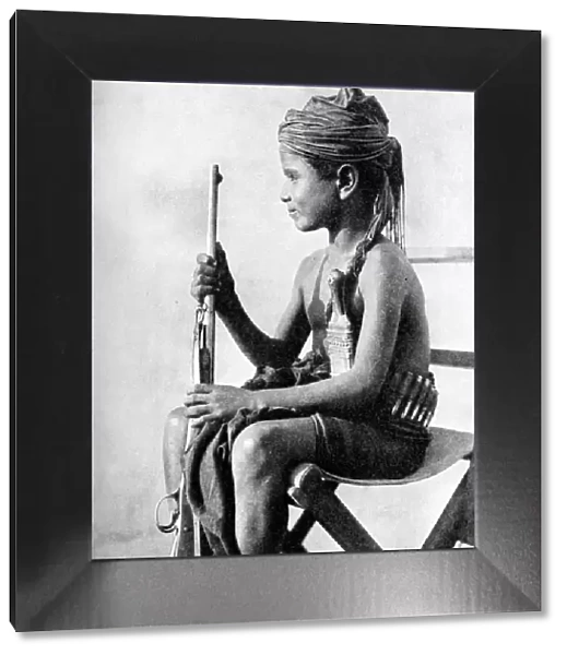 Boy with a gun, Aden Protectorate, Arabia, 1936. Artist: Fox