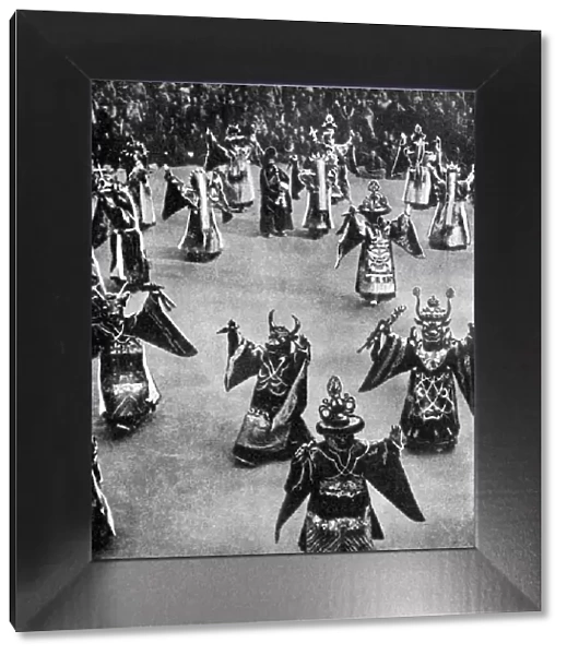 Masked dancers, Tibet, 1936. Artist: Ewing Galloway